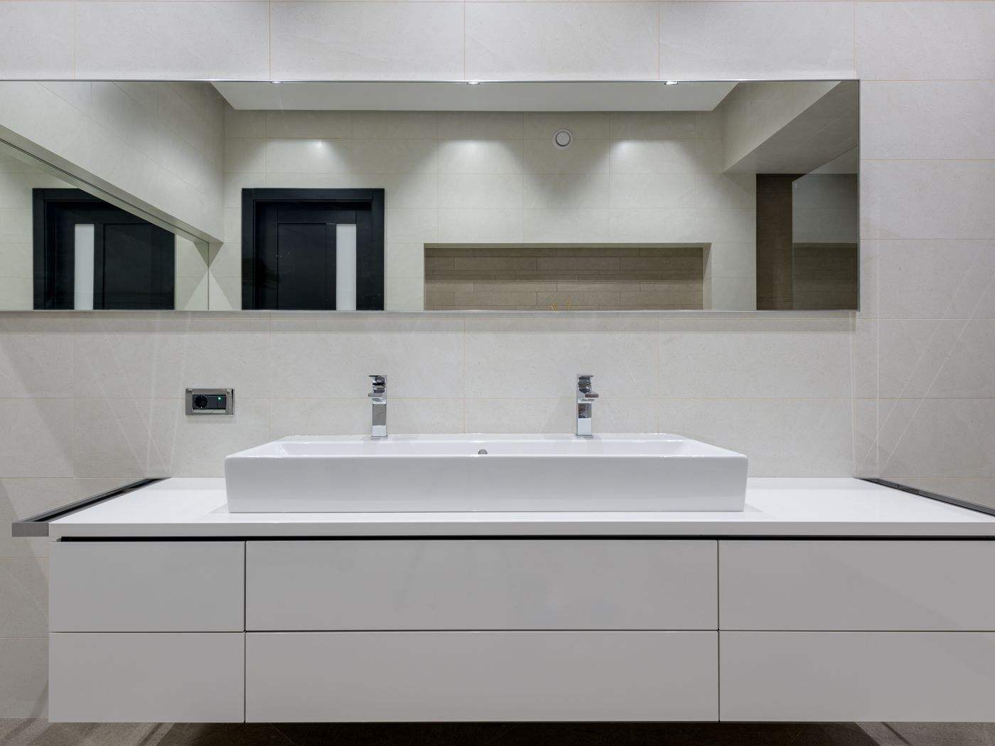 Bathroom vanity with double sinks, a common cabinet painting project in Newton homes
