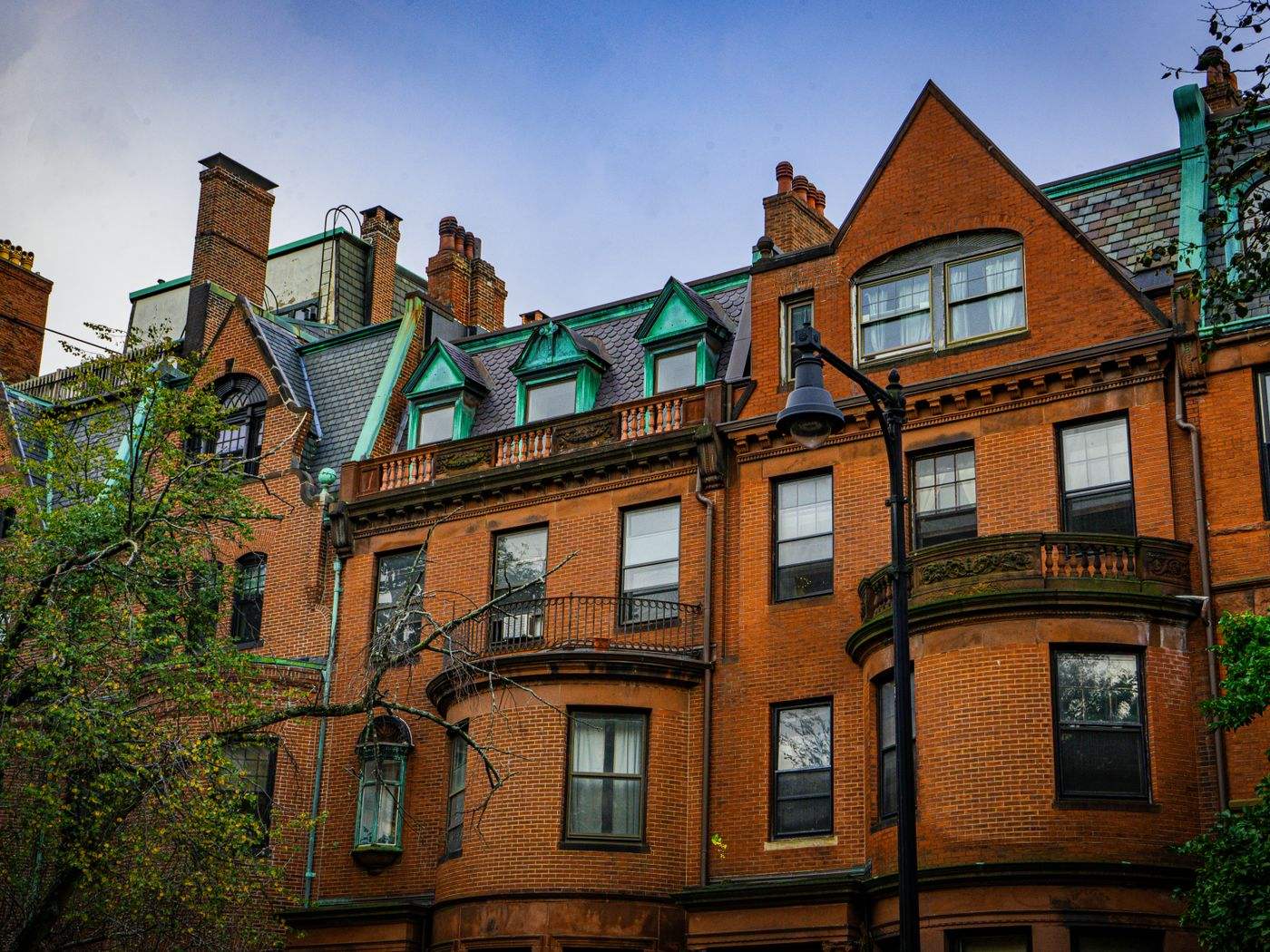 Historic brick row houses like many older Brookline homes where lead-safe cabinet painting applies