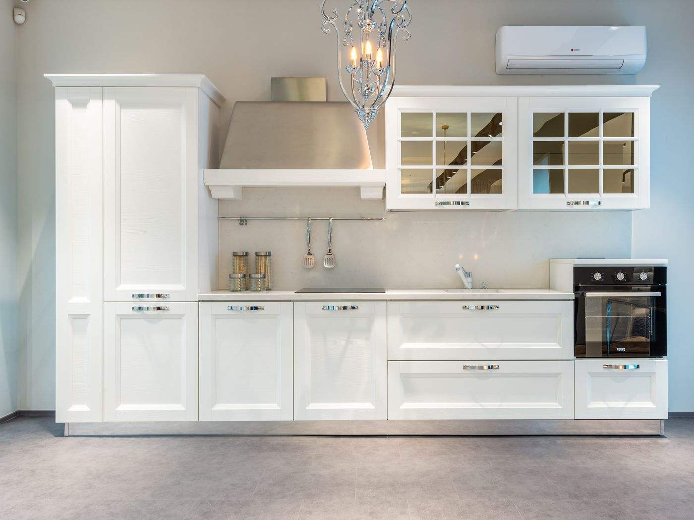 Cabinet painting Cambridge MA: Modern apartment kitchen with white cabinets and built-in appliances