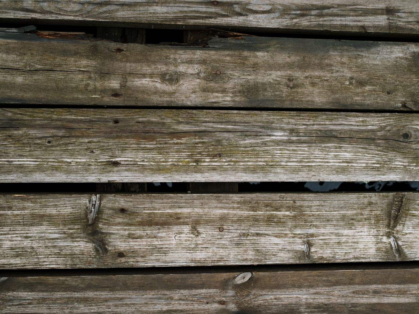 Weathered wood deck boards before deck painting or deck staining