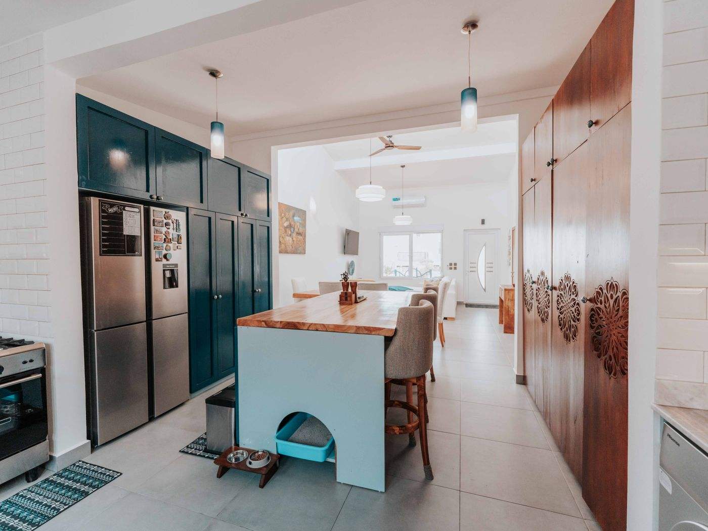 Cabinet painting Waltham MA: Spacious kitchen with a central island and painted cabinetry