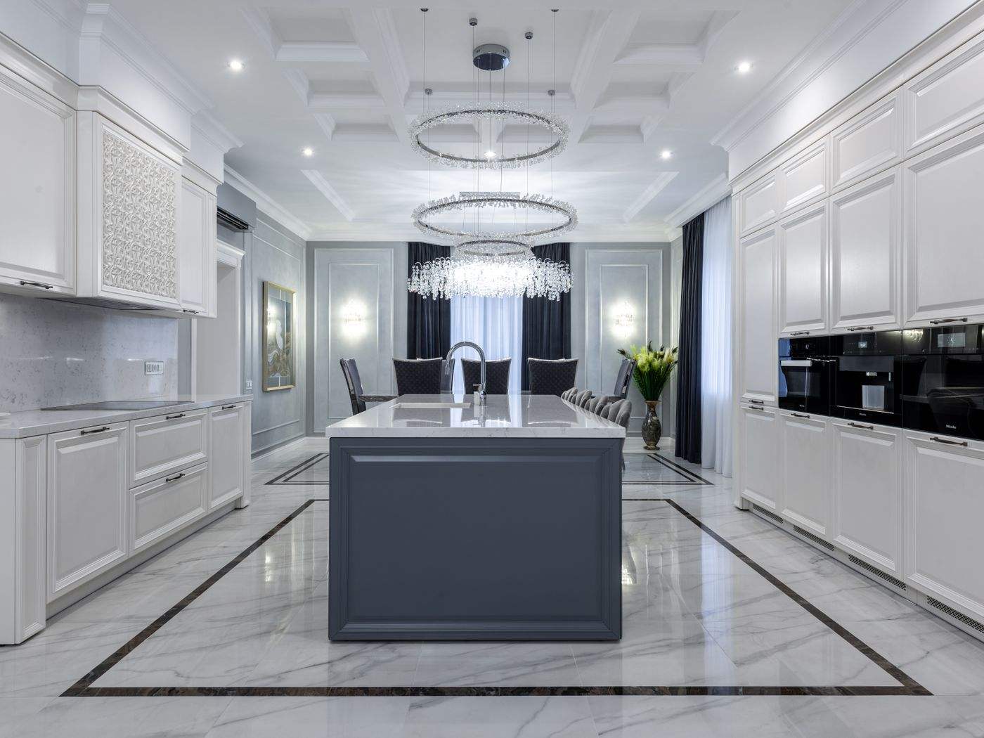 Cabinet painting Brookline MA: Light, minimal kitchen with pale cabinetry in a contemporary apartment
