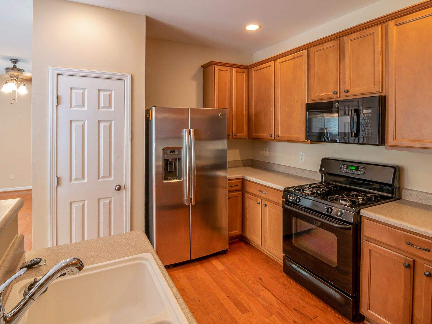 Natural wood kitchen cabinets, the kind often painted a lighter color in Waltham cabinet refinishing